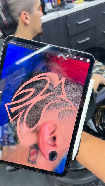Tablet preview of a bold custom hair design aligned over a finished fade