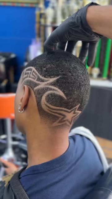 Curved graphic hair design worked into a clean fade